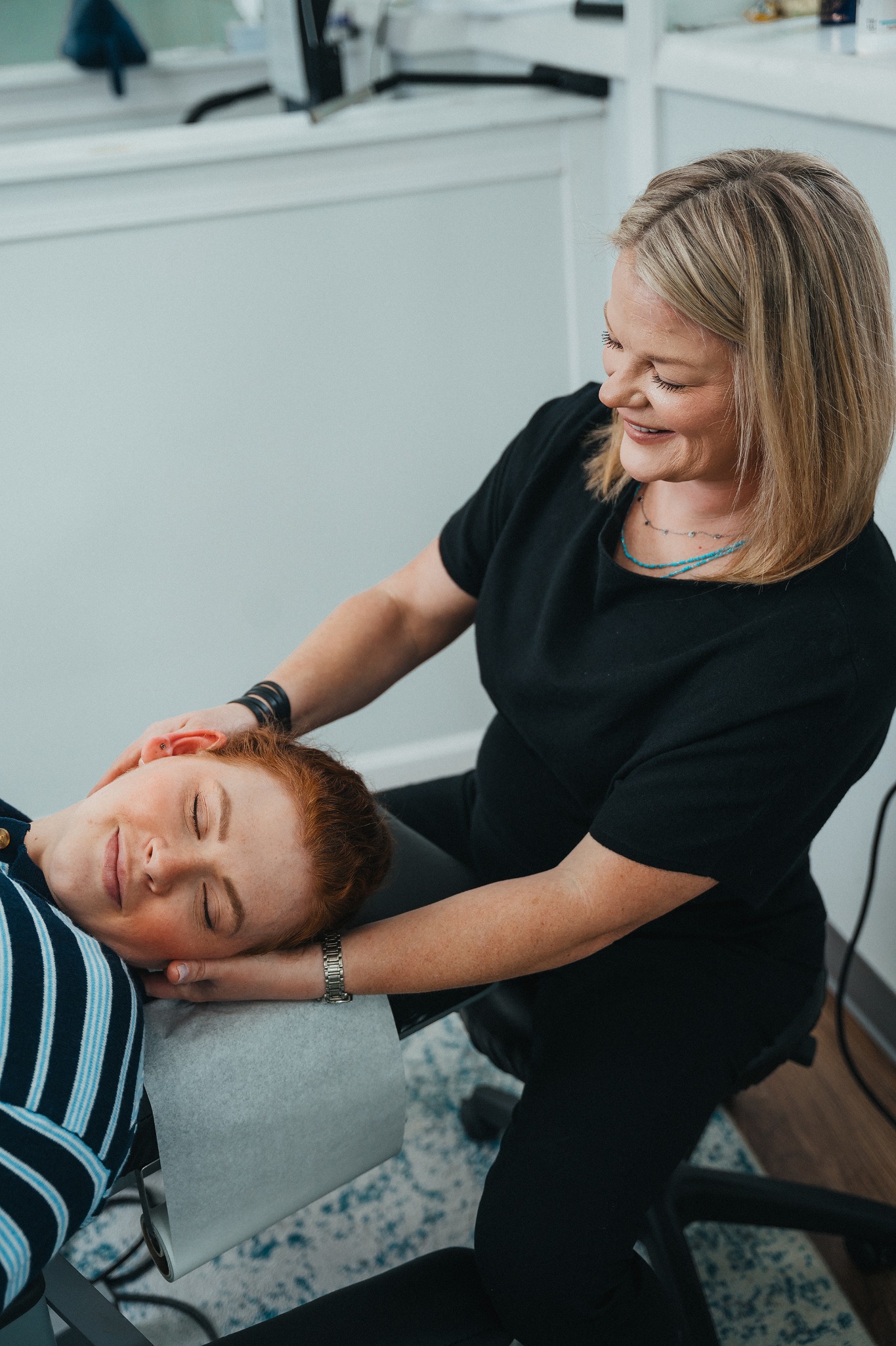 Chiropractor working with a patient
