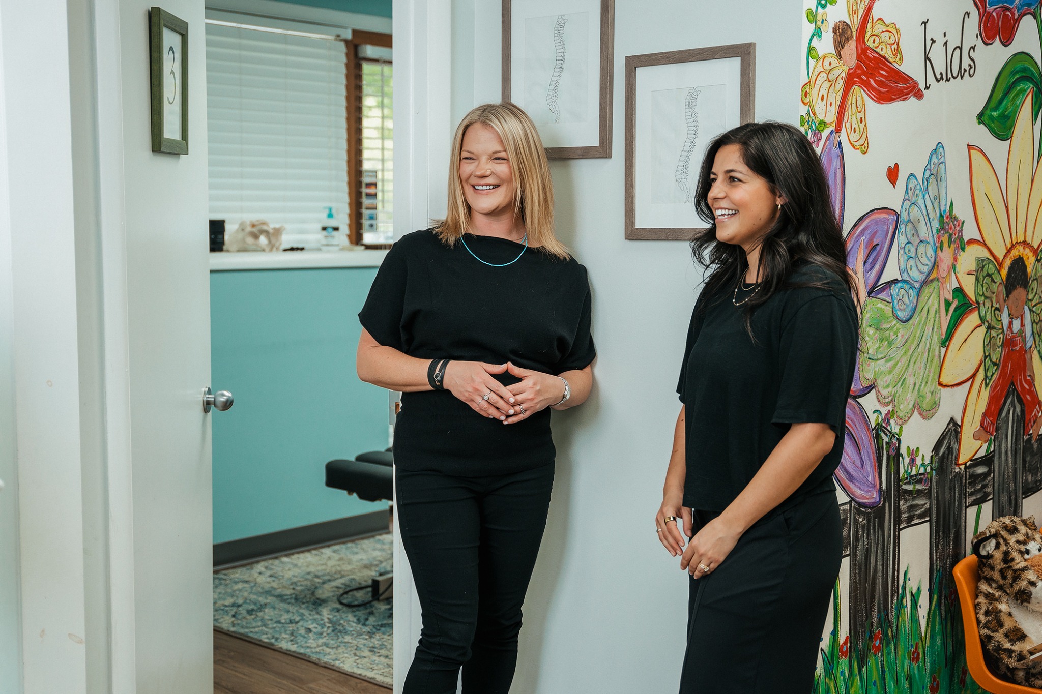 Chiropractic team members walking through their space